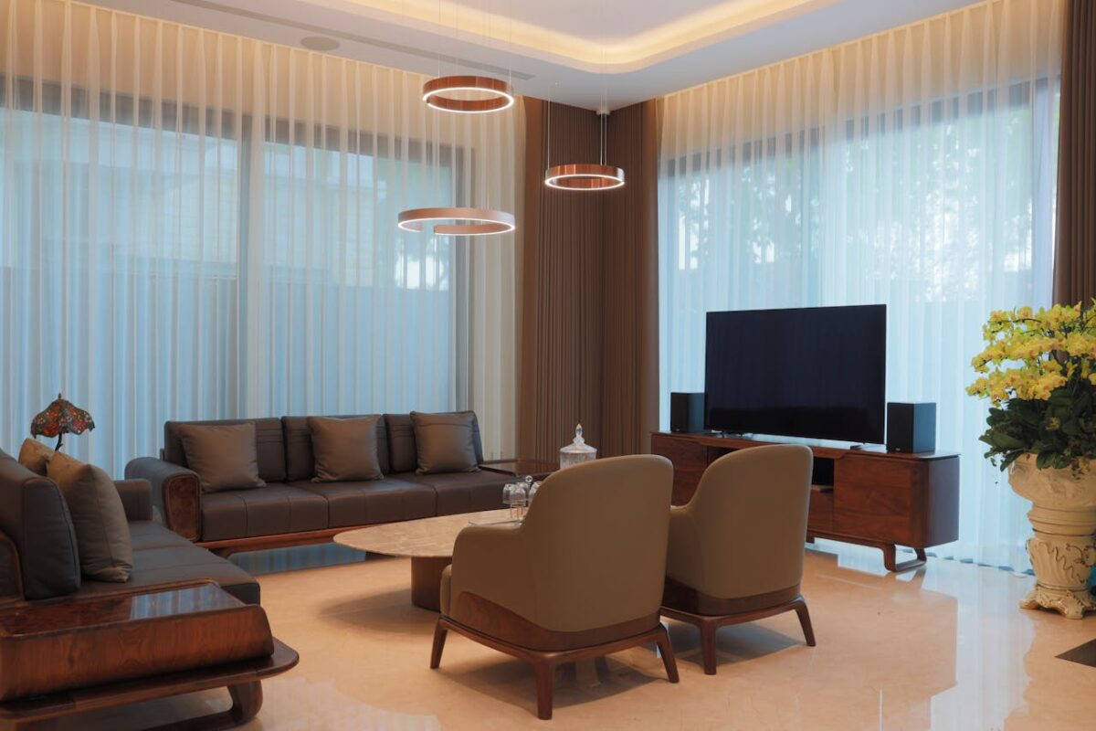 Elegant modern living room with stylish furniture and chic lighting.